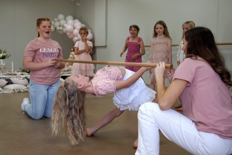 Kids playing limbo at The League Studios in Hervey Bay.